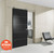 Stainless steel barn door kit installed as a bathroom door in a bedroom of a modern home